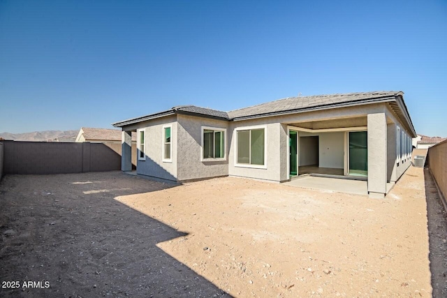 back of house featuring a patio area