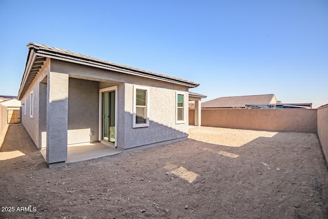 rear view of property with a patio