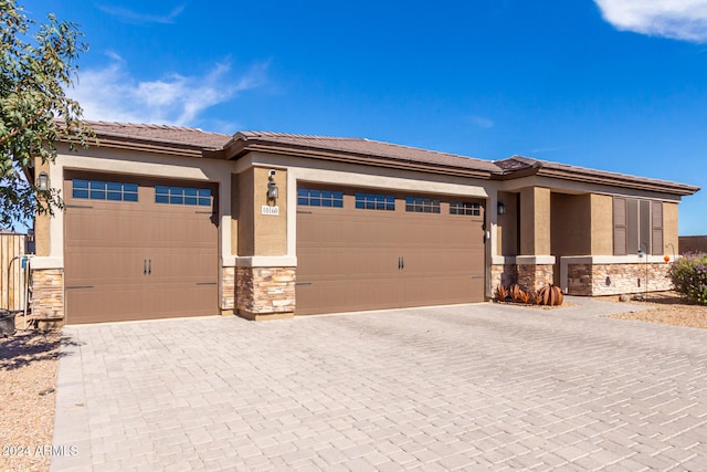 prairie-style home featuring a garage