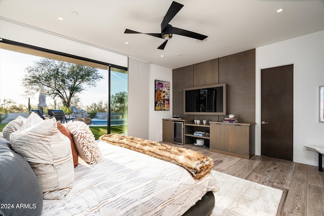 bedroom with ceiling fan, access to exterior, and light wood-type flooring