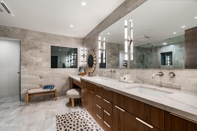 bathroom featuring tile walls and a shower with shower door