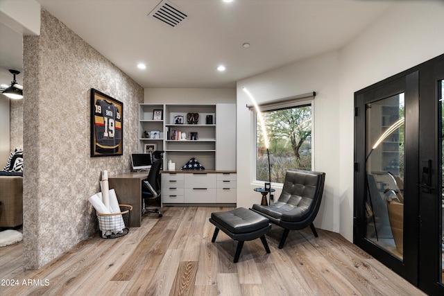 sitting room with light hardwood / wood-style flooring