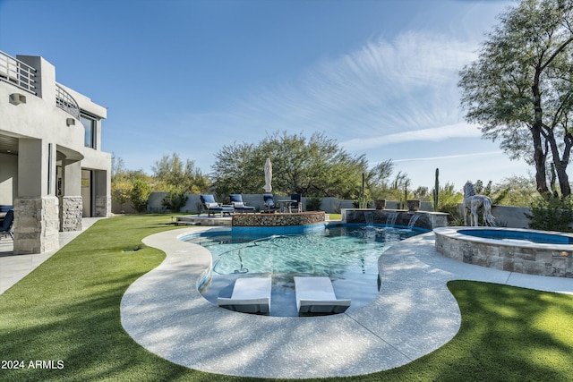 view of swimming pool featuring an in ground hot tub, pool water feature, and a patio