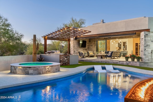 pool at dusk with an outdoor living space, an in ground hot tub, an outdoor kitchen, and a patio