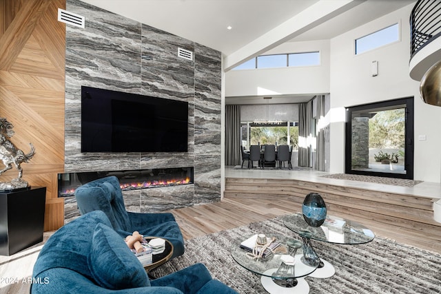 living room with a fireplace and hardwood / wood-style floors