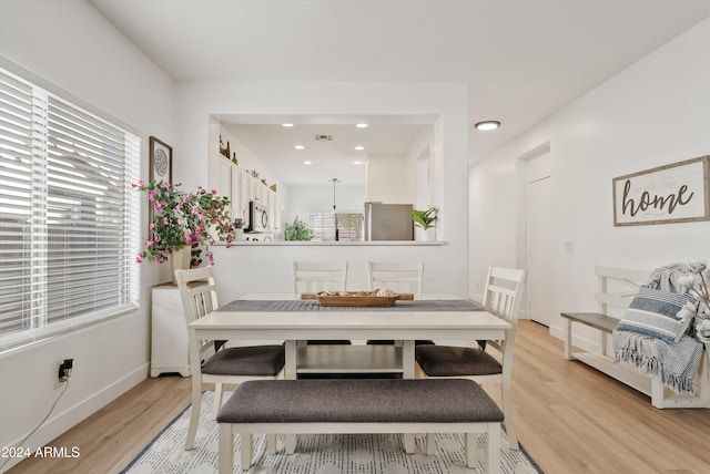 dining room with light hardwood / wood-style floors