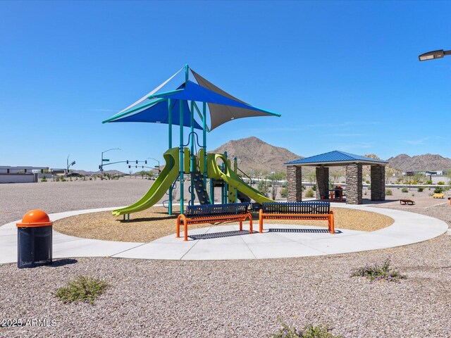 communal playground with a mountain view and a gazebo