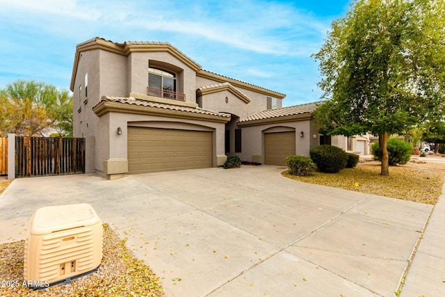 mediterranean / spanish-style house with a garage