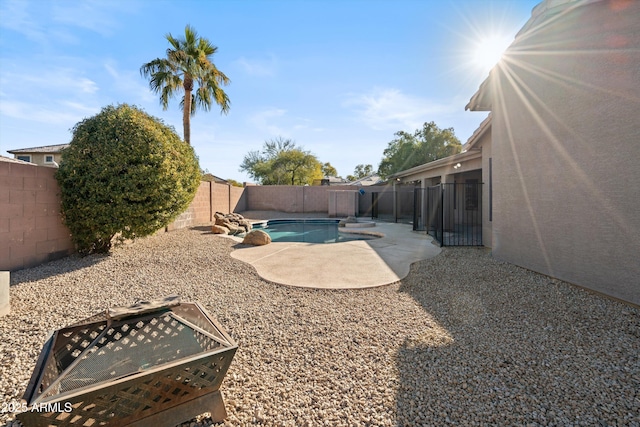 view of yard featuring a patio area and a fenced in pool