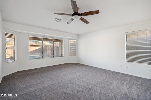 carpeted empty room featuring ceiling fan