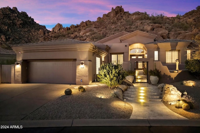 view of front of property featuring a garage