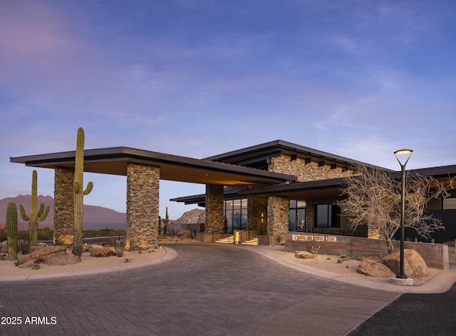 view of front of house with a mountain view and stone siding