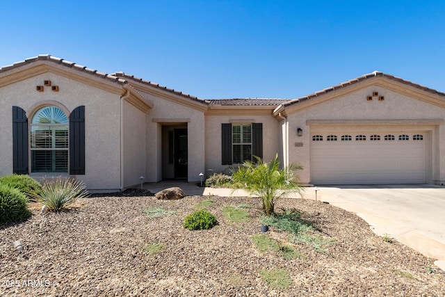 4229 E Nightingale Ln, Gilbert, AZ 85298 - view of front of home featuring a tiled roof, stucco siding, a garage, and driveway