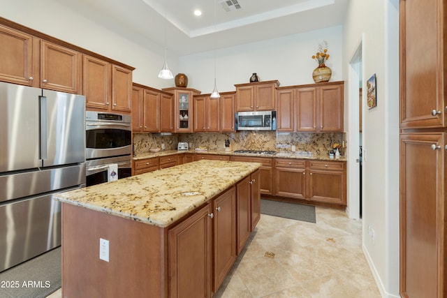 4229 E Nightingale Ln, Gilbert, AZ 85298 - kitchen with stainless steel appliances, brown cabinets, backsplash, glass insert cabinets, and recessed lighting