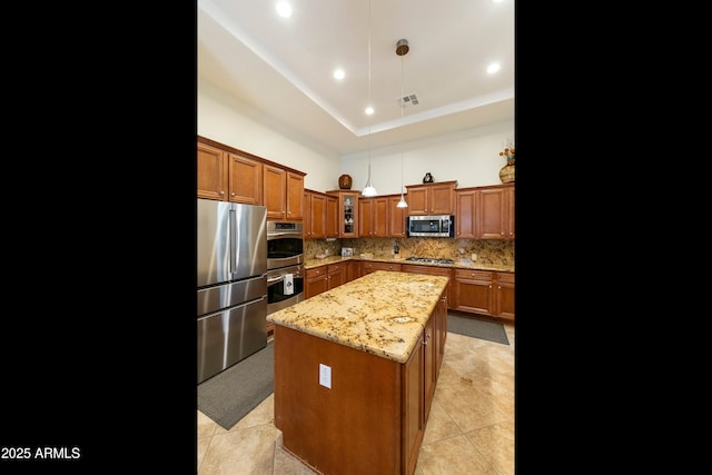 4229 E Nightingale Ln, Gilbert, AZ 85298 - kitchen featuring stainless steel appliances, brown cabinets, decorative backsplash, glass insert cabinets, and light stone counters
