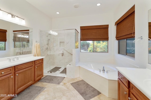 4229 E Nightingale Ln, Gilbert, AZ 85298 - full bath with vanity, a garden tub, a shower stall, healthy amount of natural light, and recessed lighting