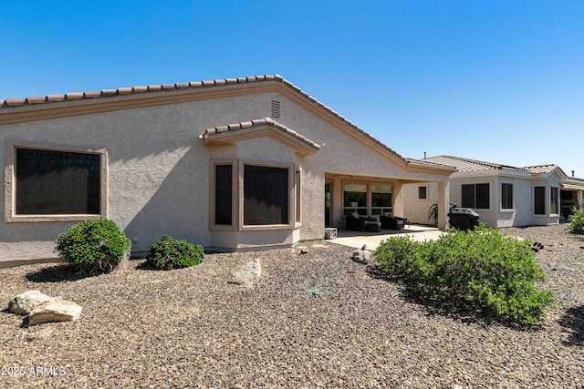 4229 E Nightingale Ln, Gilbert, AZ 85298 - rear view of house with a patio area, stucco siding, and a tiled roof