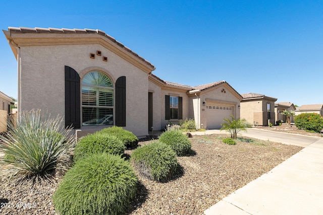 4229 E Nightingale Ln, Gilbert, AZ 85298 - mediterranean / spanish house with stucco siding, a garage, driveway, and a tile roof