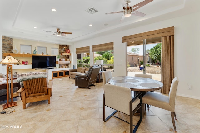 4229 E Nightingale Ln, Gilbert, AZ 85298 - dining space with a tray ceiling, a ceiling fan, light tile patterned flooring, recessed lighting, and baseboards
