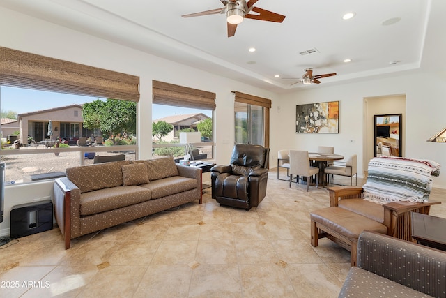 4229 E Nightingale Ln, Gilbert, AZ 85298 - living area with ceiling fan, recessed lighting, a tray ceiling, and light tile patterned floors