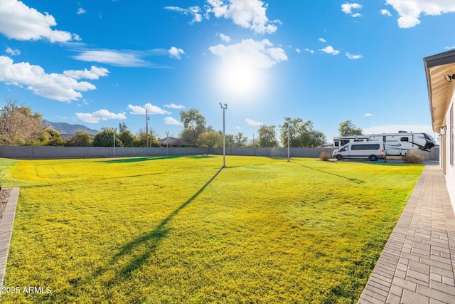 view of community featuring a mountain view and a lawn