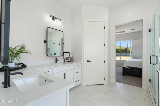 bathroom with walk in shower and vanity