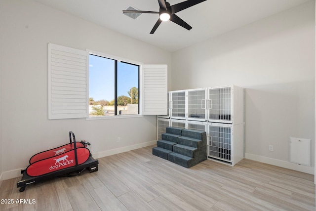 misc room with light hardwood / wood-style floors, vaulted ceiling, and ceiling fan