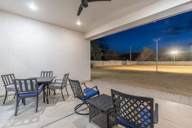 view of patio featuring ceiling fan