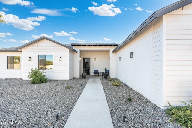 doorway to property featuring a patio area