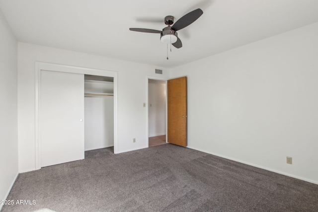 unfurnished bedroom featuring carpet, a closet, and ceiling fan