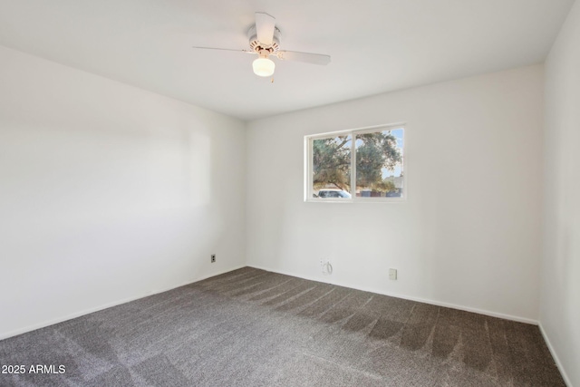 unfurnished room featuring ceiling fan and carpet floors