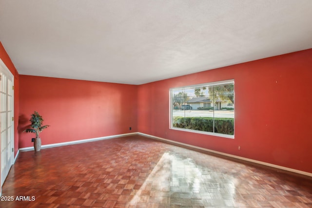 spare room with parquet flooring