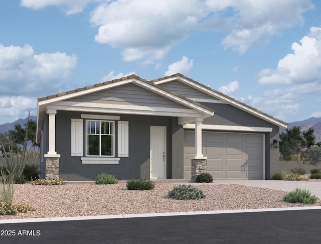 view of front of house with a mountain view, driveway, an attached garage, and stucco siding