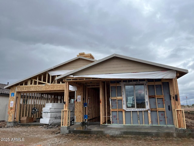 property in mid-construction with an outdoor structure