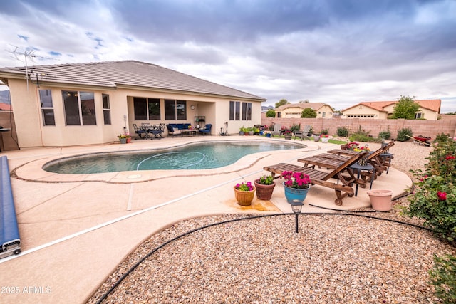 view of pool featuring a patio, a fenced in pool, and a fenced backyard