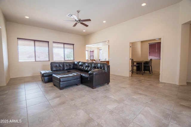 living area with light tile patterned floors, recessed lighting, visible vents, and ceiling fan