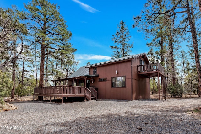2055 Badger Ln, Overgaard, AZ 85933 - view of side of home with a wooden deck and metal roof