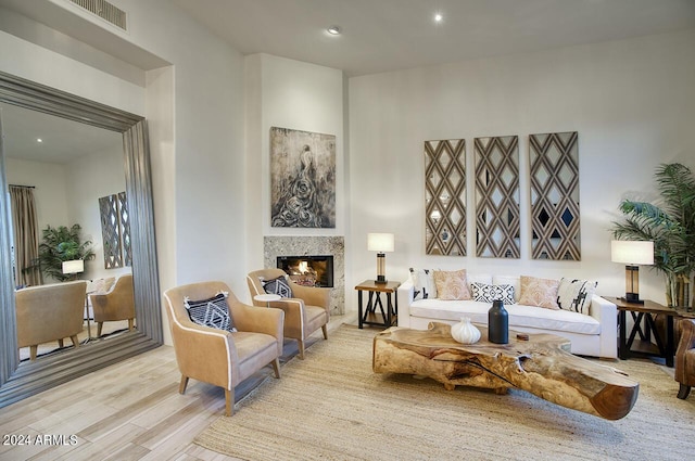 30600 N Pima Rd Unit 49, Scottsdale, AZ 85266 - living area with recessed lighting, light wood-type flooring, visible vents, and a glass covered fireplace
