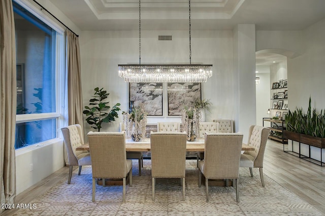 30600 N Pima Rd Unit 49, Scottsdale, AZ 85266 - dining space featuring arched walkways, visible vents, and wood finished floors