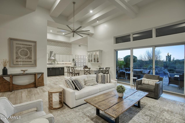 30600 N Pima Rd Unit 49, Scottsdale, AZ 85266 - living room featuring beamed ceiling, a ceiling fan, recessed lighting, light wood finished floors, and a towering ceiling