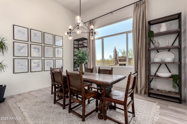 30600 N Pima Rd Unit 49, Scottsdale, AZ 85266 - dining area featuring a chandelier and light wood-style flooring