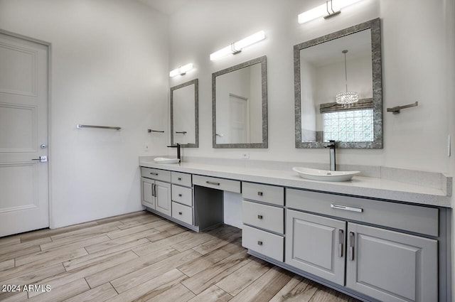 30600 N Pima Rd Unit 49, Scottsdale, AZ 85266 - bathroom with double vanity, wood finished floors, and a sink