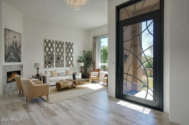 30600 N Pima Rd Unit 49, Scottsdale, AZ 85266 - entryway with a chandelier, recessed lighting, wood finished floors, and a premium fireplace