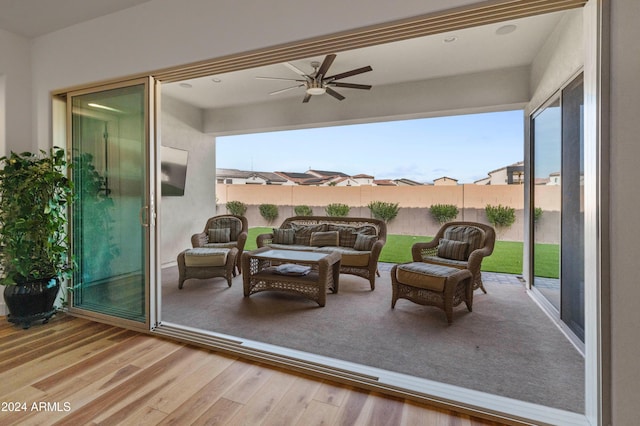 view of patio with ceiling fan and an outdoor hangout area