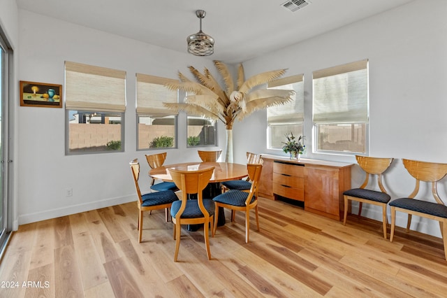 dining area with light hardwood / wood-style flooring