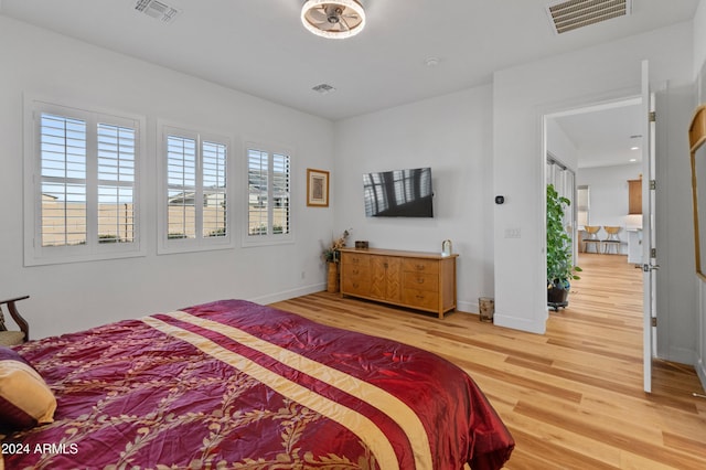 bedroom with wood-type flooring