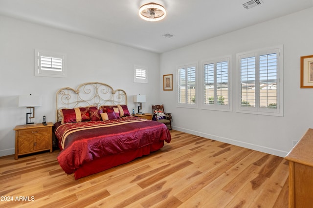 bedroom with light hardwood / wood-style flooring