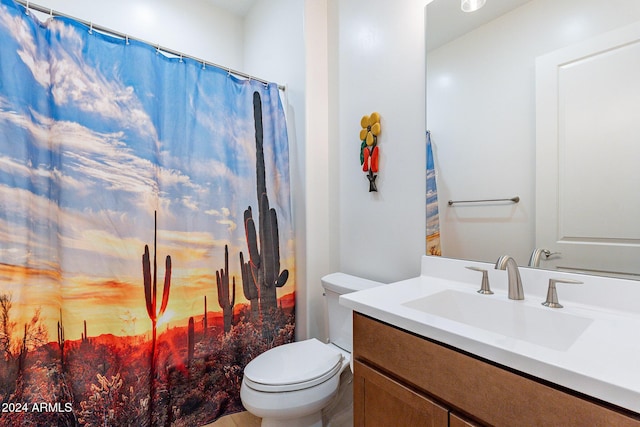 bathroom with a shower with curtain, vanity, and toilet