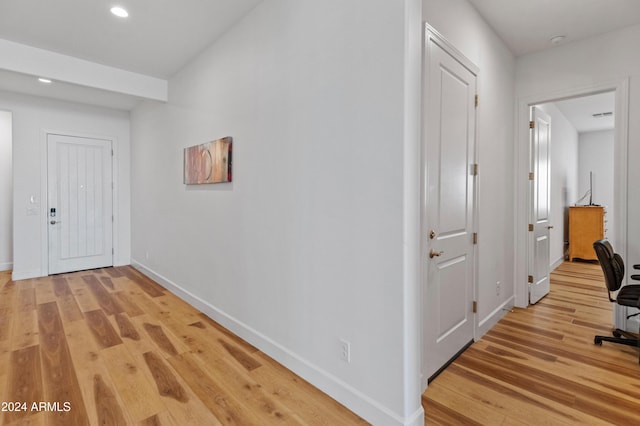 hallway with light wood-type flooring