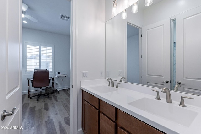 bathroom featuring ceiling fan, vanity, and hardwood / wood-style flooring